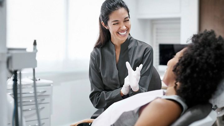 A doctor using an intraoral scanner