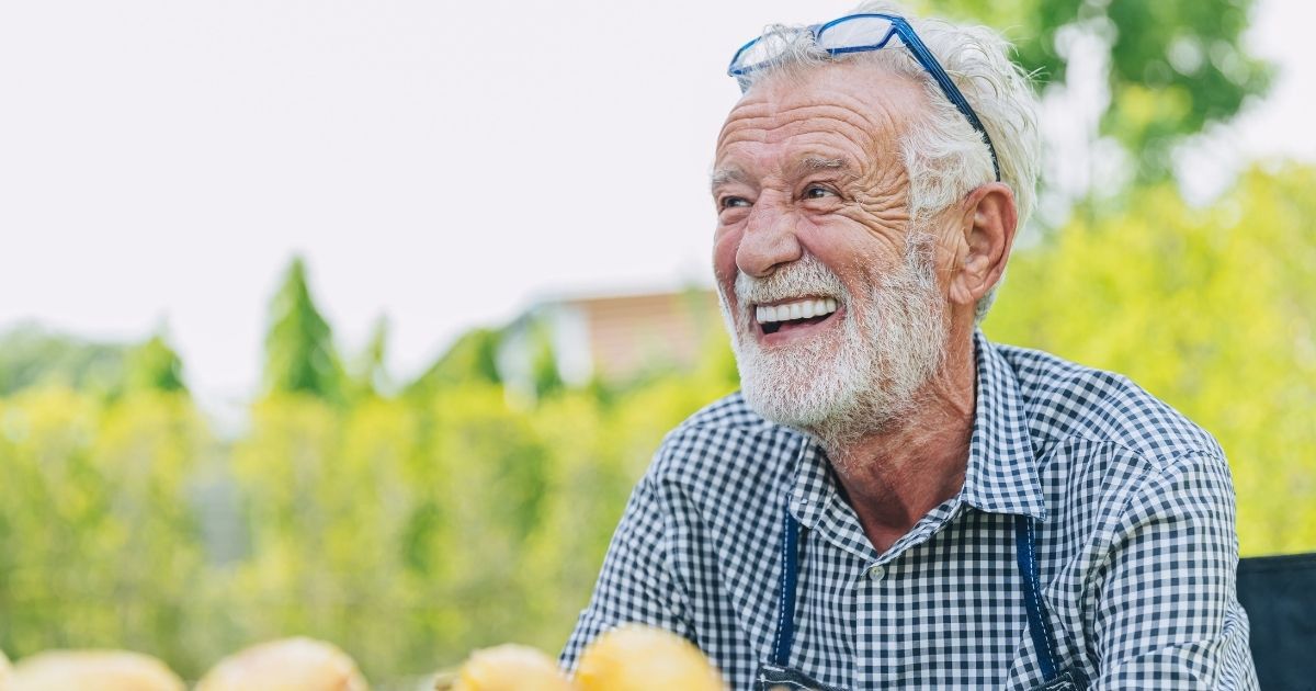 A man eating apples after a dental implant procedure